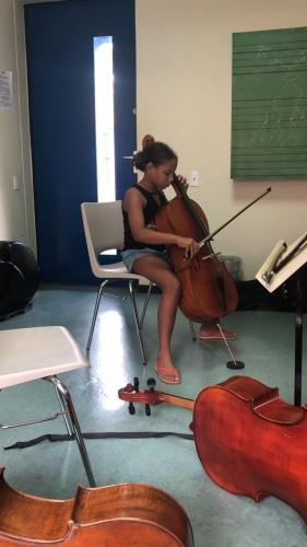 My girlie with curlies 💜  Stretch Position on the Cello