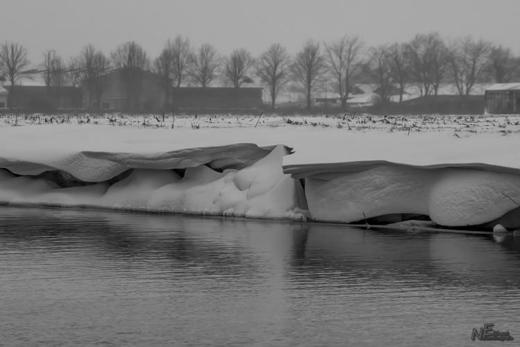 Snow down the ditch side.
